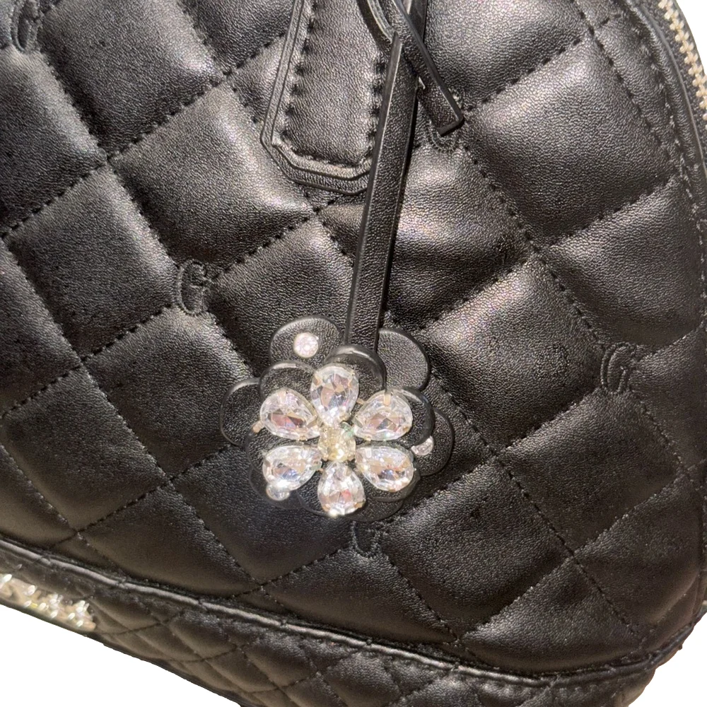 Black Quilted Floral Satchel by GUESS